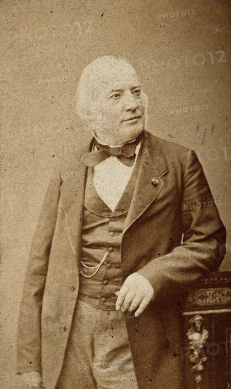An unidentified man leaning on a cabinet, c1880s. Creator: Frederick Mulnier.