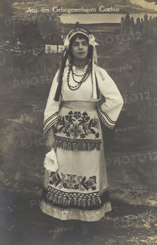 A Ukrainian prisoner of war performing a dance at a prisoner... (between 1910 and 1919?). Creator: Paul Tharan.