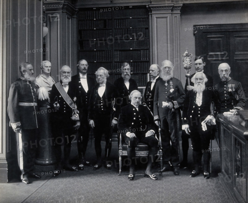 Fellows of the Royal Society: Sir John Evans, bust of Sir Isaac Newton, Lord Kelvin, RB Clifton... Creator: Mayall.