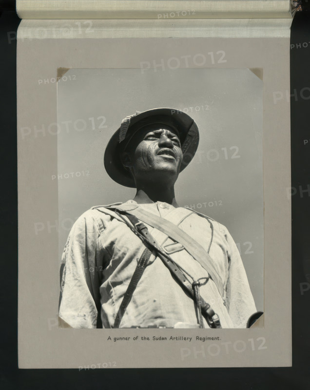 A gunner of the Sudan Artillery Regiment, 1964. Creators: Colonial Office, Unknown.