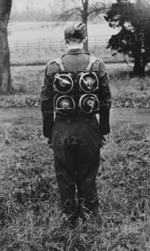 Limpet mines being carried on a harness on the back of a soldier, c1943. Creator: British Government.