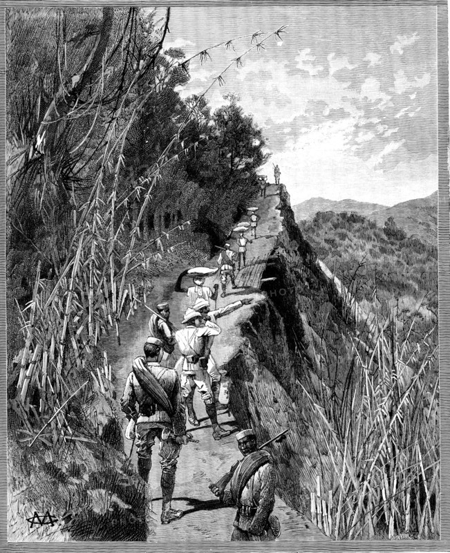 With the Lushai Expedition: coolies carrying bags of rice up a mountain path, 1890. Creator: R. Taylor.