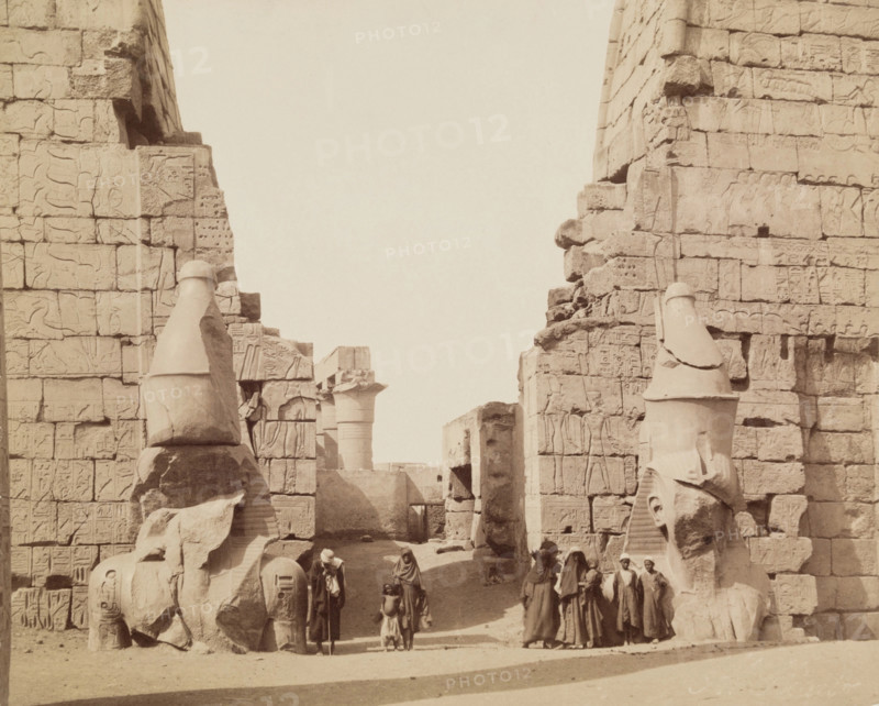 Entrance to Temple of Luxor with Colossal Statues of Luxor, East Bank Ramesses, between 1860 & 1903. Creator: Antonio Beato.