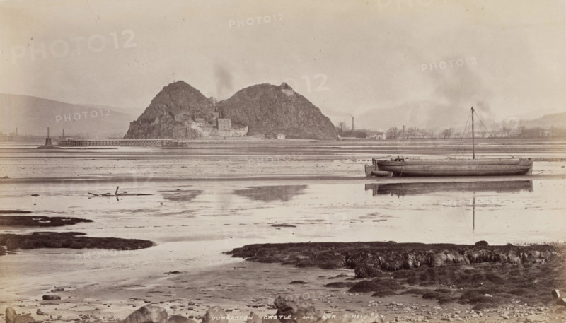 Dumbarton Castle and pier on the Clyde, between 1870 and 1880. Creator: James Valentine.