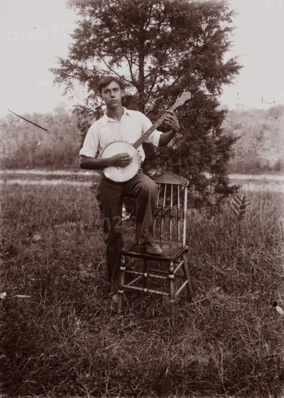 Untitled (man with banjo, neg, #1), c1931, printed c1975. Creator: Wendell Hotter.