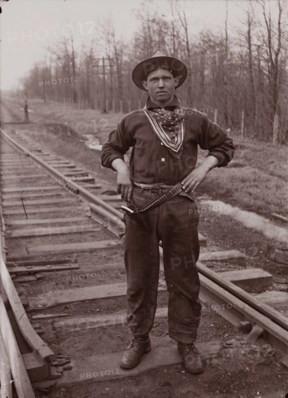 Untitled (man with pistol on railroad tracks, neg. #14), between 1910 and 1935, printed c1975. Creator: Wendell Hotter.