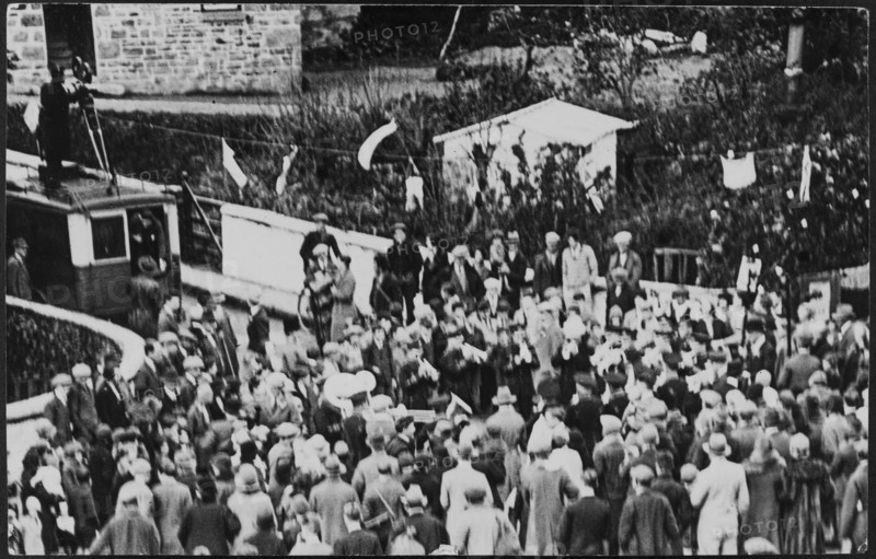 Crowd of people on Flora Day for the Helston Furry Dance, Helston, Cornwall, 1925-1935. Creator: George R Long.
