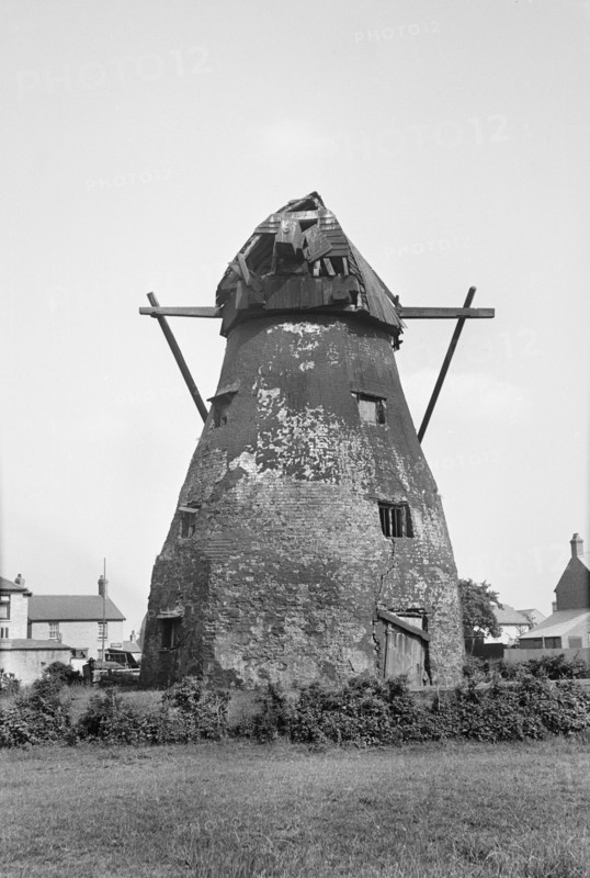 Exterior view of the derelict tower mill on Mill Green, Warboys, Cambridgeshire, 1936. Creator: HES Simmons.