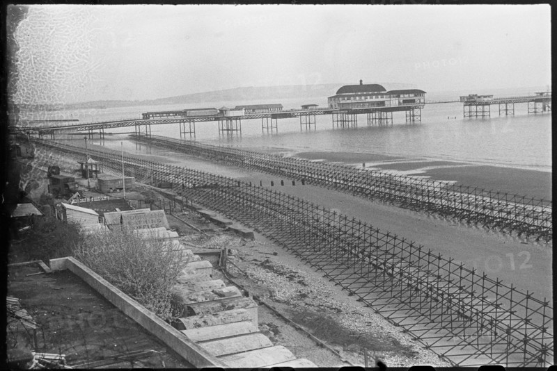 Looking north-east over the beach at Shanklin, showing Admiralty scaffolding, Isle Of Wight, 1945. Creator: George R Long.