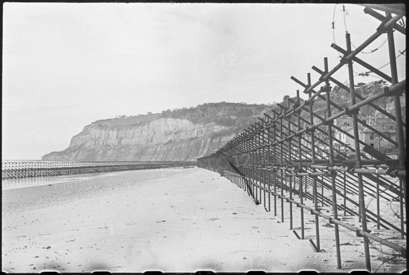 View looking south along the beach at Shanklin, showing Admiralty scaffolding, Isle Of Wight, 1945. Creator: George R Long.