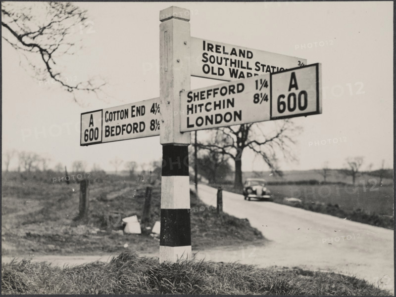 Finger post road sign on the A600 between Bedford and Shefford, Southill, 1940-1960. Creator: George R Long.