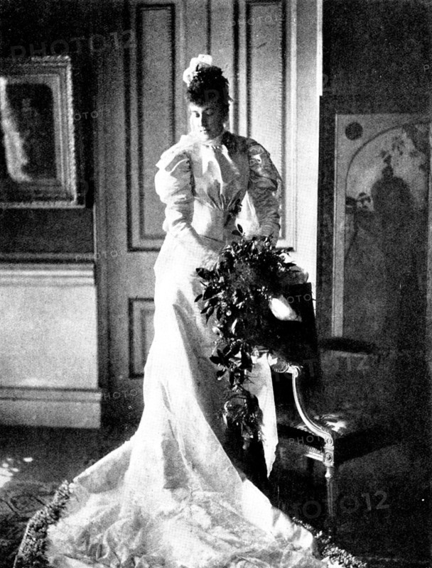 Marriage of the Duc d'Aosta & Princesse Hélène d'Orléans: the Duchesse...in her wedding dress, 1895. Creator: Gunn & Stuart.