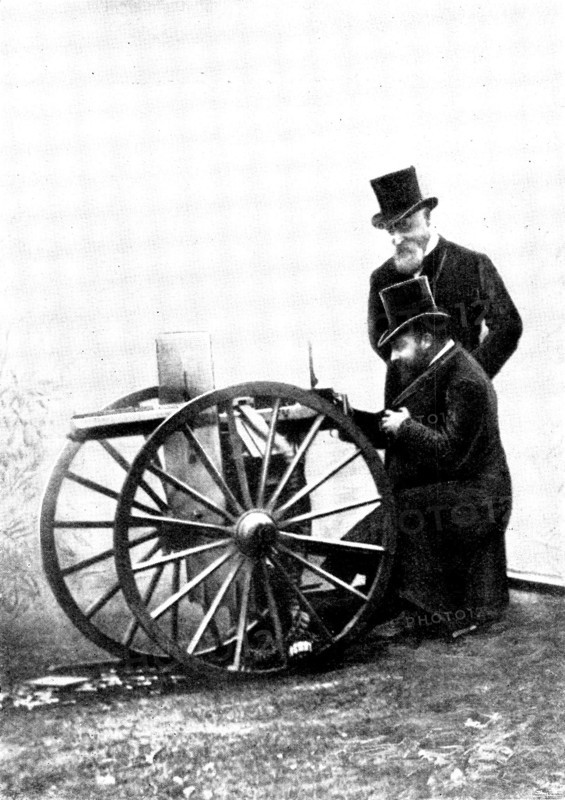The Prince of Wales firing a Maxim Gun: Mr. Maxim standing by, 1898. Creator: Russell & Sons.