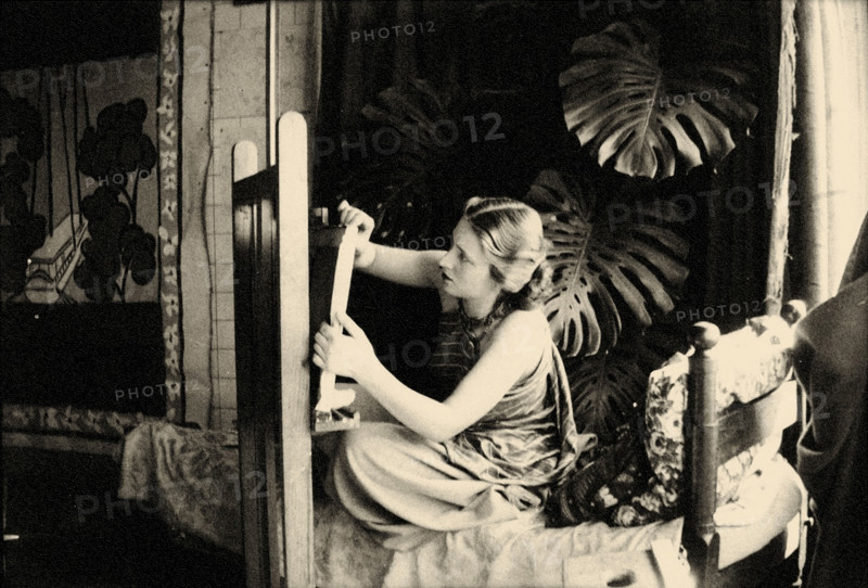 Lydia Delectorskaya preparing a canvas in Matisse’s studio, Place Charles-Félix, Nice, 1936. Creator: Matisse, Henri (1869-1954).