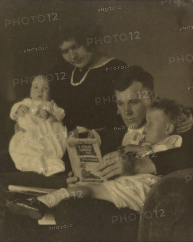 Family Portrait with A Child's Garden of Verses, about 1920. Creator: Louis Fleckenstein.