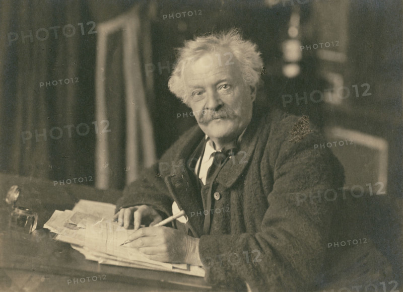 Félix Nadar seated at writing table, 1905-1910. Creator: Nadar.
