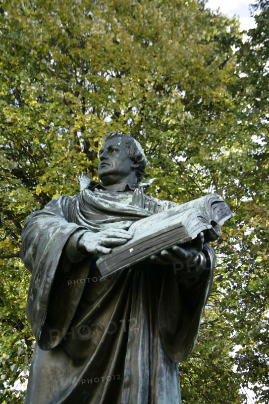 Bronze statue of Martin Luther next to the Marienkirche, (St Mary's Church), Berlin, Germany, 2025.  Creator: LTL.