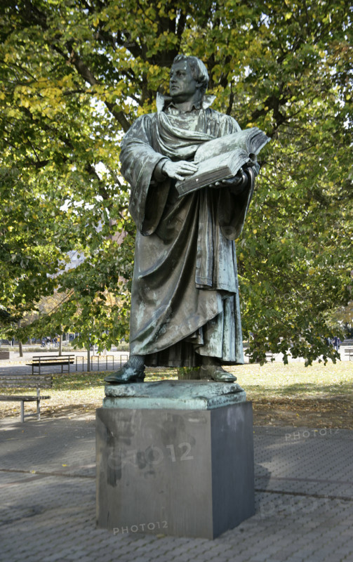 Bronze statue of Martin Luther next to the Marienkirche, (St Mary's Church), Berlin, Germany, 2025.  Creator: LTL.