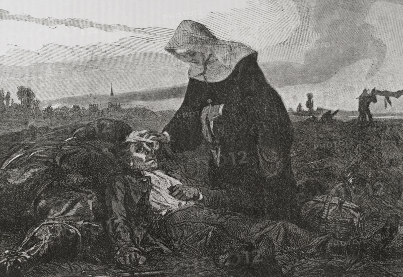 Franco-Prussian War (1870-71): Sisters of Charity on the battlefield, tending to the wounded, 1870.  Creator: Unknown.