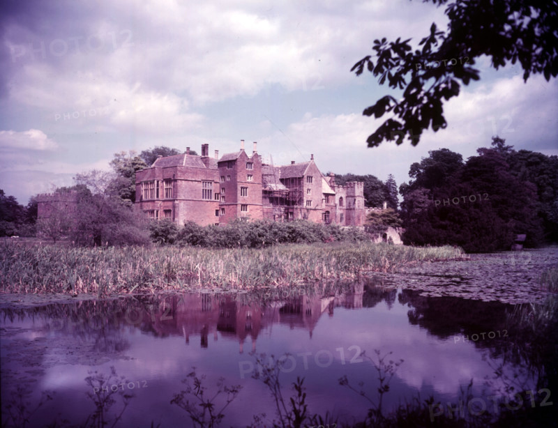 Broughton Castle and moat, Oxfordshire, c1955. [gateway, church] Creator: Arthur Charles Kirby Ware.