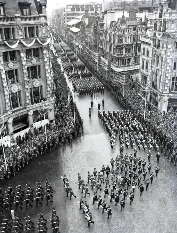 Crowds watching the coronation procession of Queen Elizabeth II, Oxford Circus, London, 2 June 1953. Creator: Arthur Charles Kirby Ware.