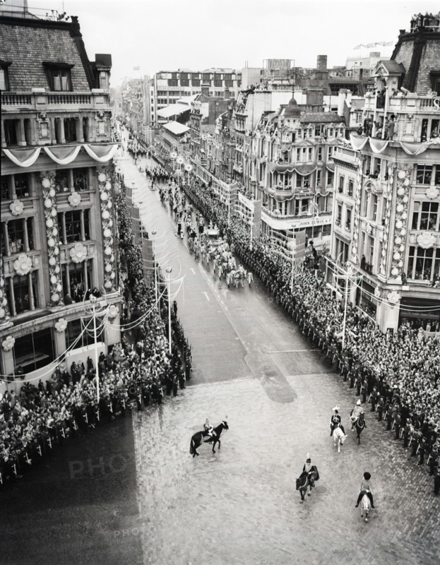 Crowds watching the coronation procession of Queen Elizabeth II, Oxford Circus, London, 2 June 1953. Creator: Arthur Charles Kirby Ware.