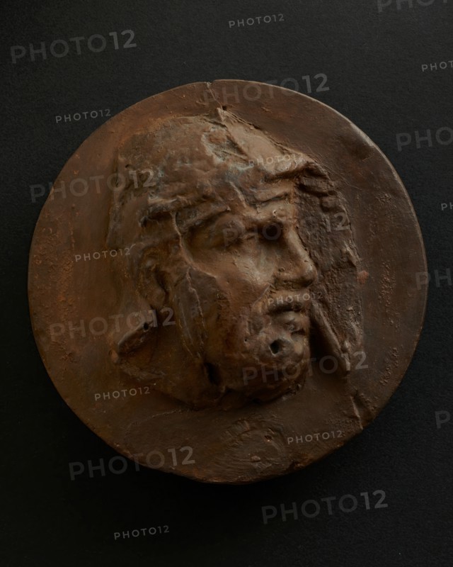 Cast of head of barbarian auxiliary with moustache in helmet. Creator: Unknown.