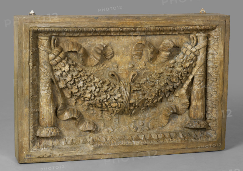 Cast of panel with oak-leaf garland between candelabra, late 18th century-early 19th century. Creator: Unknown.