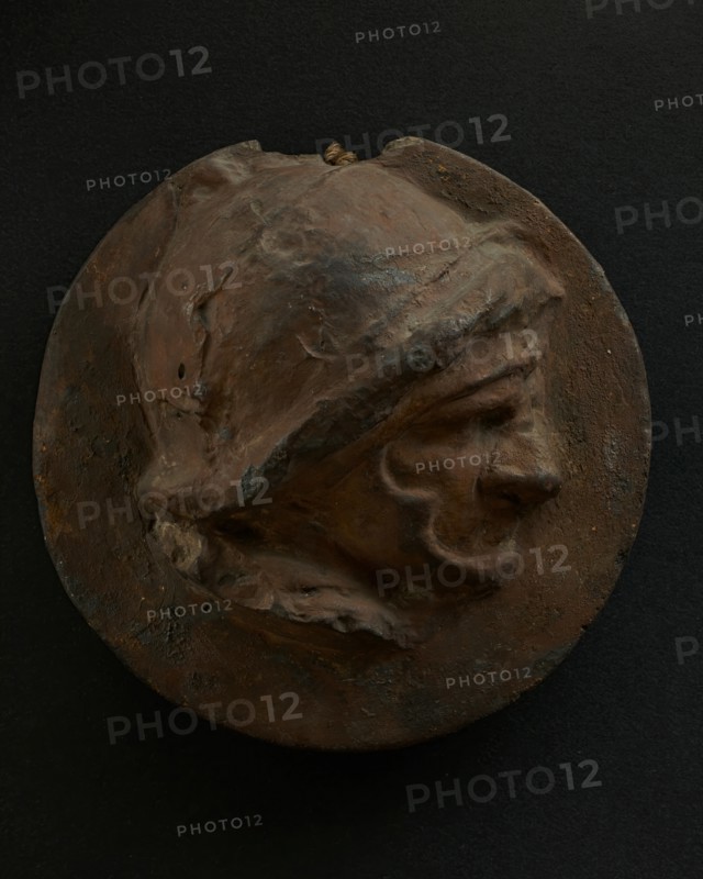 Cast of foreshortened head of Roman soldier in helmet. Creator: Unknown.