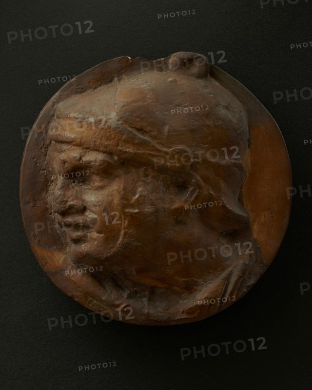 Cast of the head of Roman soldier in helmet with raised right arm. Creator: Unknown.