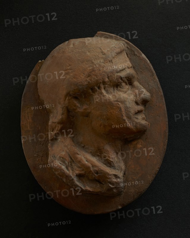 Cast of head of Roman soldier with creased brow. Creator: Unknown.