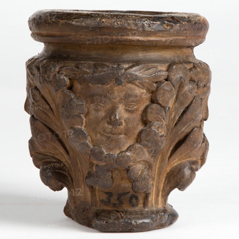 Cast of a medieval capital with leaf foliage and faces, possibly representing the Green Man, c1870. Creator: Unknown.
