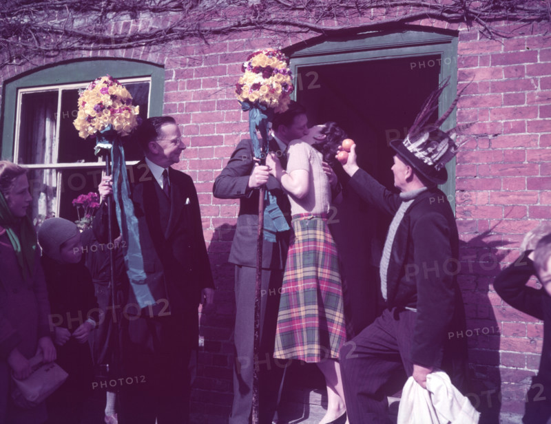 Tutti Men claiming a kiss, Hocktide Festival, Hungerford, Berkshire, c1955. Creator: Arthur Charles Kirby Ware.