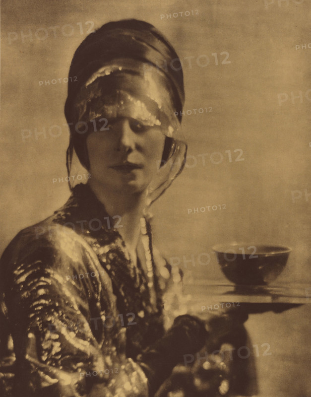 The Cup. Portrait of a woman holding a cup, c1910. Creator: Baron Adolf Edward Sigismond de Meyer.