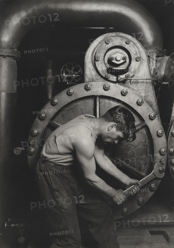 Power house mechanic working on steam pump, 1920. Creator: Lewis Wickes Hine.
