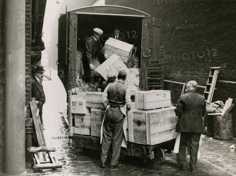 Unloading the exhibits for the 'International Exhibition of Chinese Art', 1935. Creator: Topical Press Agency.