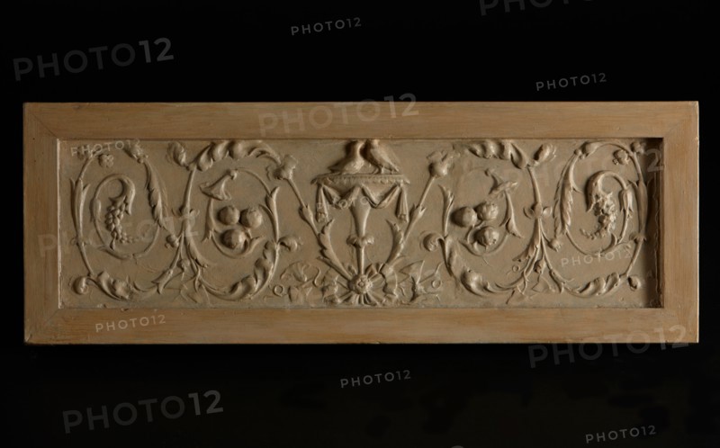 Decorative relief: Two doves on urn with scrolling vines at either side. Creator: Unknown.