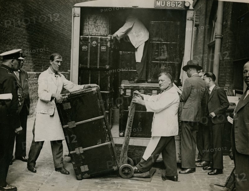 Staff from Bishop & Sons Depositories Ltd unload a case at Burlington House, 1935. Creator: Topical Press Agency.