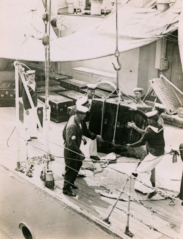 Lifting a case from the deck of  H.M.S. Suffolk at Portsmouth, July 1935. Creator: Topical Press Agency.