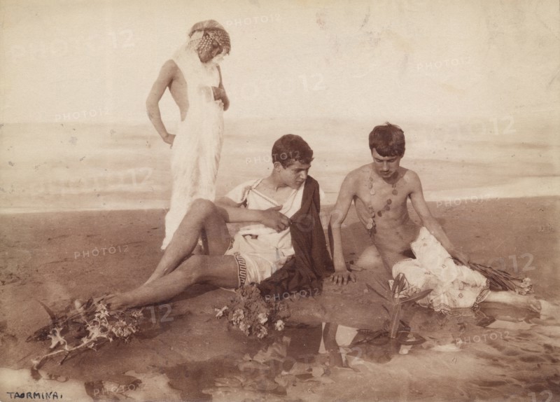 Three youths dressed in pseudo-ancient Greek or Roman costume,  Taormina, Sicily, c1890s. Creator: Count Wilhelm von Gloeden.