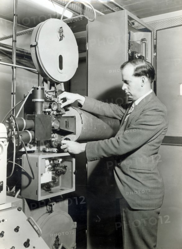 Man operating film projector, c1955. Creator: Arthur Charles Kirby Ware.