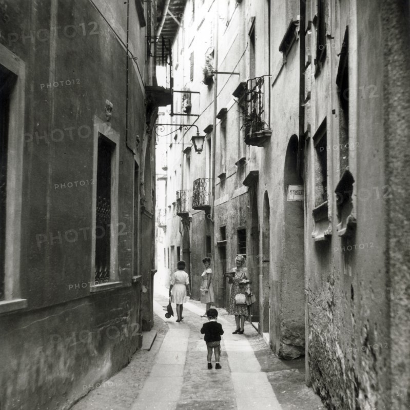Narrow street in Orta San Giulio, Lake Orta, Italy, c1955.  Creator: Arthur Charles Kirby Ware.