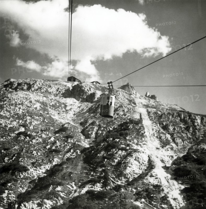 Cable car going up to Tondi di Faloria above Cortina, Dolomites, Italy, c1955.  Creator: Arthur Charles Kirby Ware.