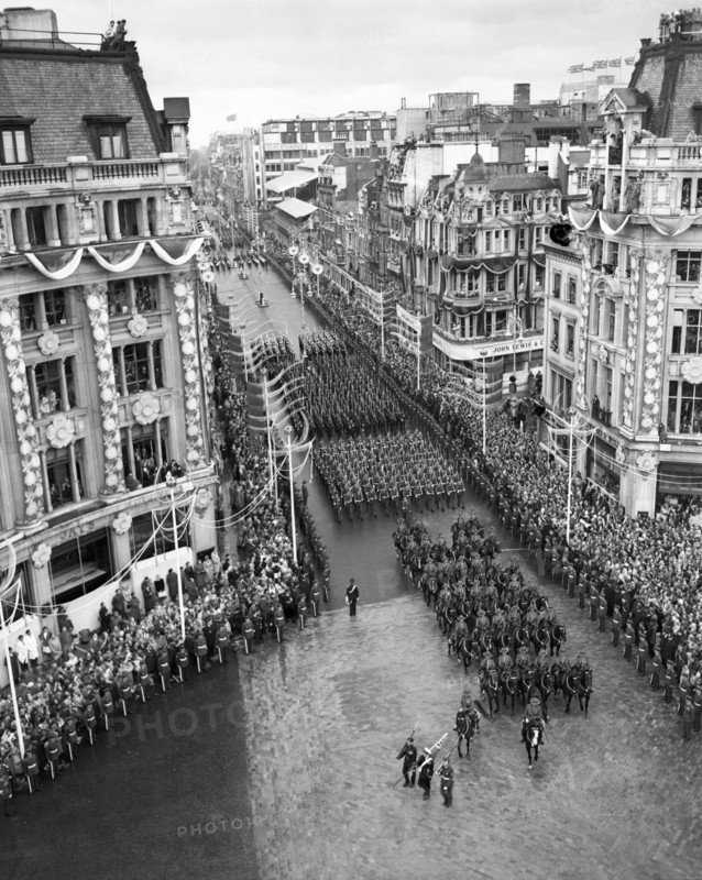 Crowds watching the coronation procession of Queen Elizabeth II, Oxford Circus, London, 2 June 1953. Creator: Arthur Charles Kirby Ware.