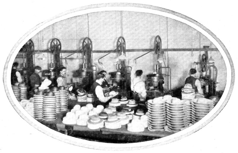 Shaping hats and helmets: the hydraulic presses at work, 1909. Creator: Unknown.