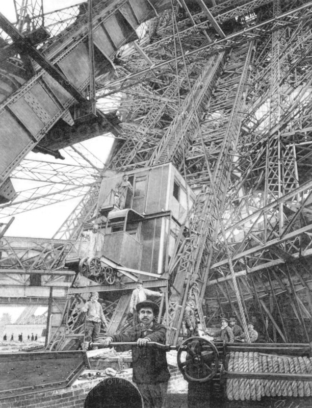Pendant l'Exposition Universelle de 1889 à Paris, des employés de la Tour Eiffel actionnent les mécanismes permettant la montée d'un des quatre ascenseurs du premier étage de l'édifice. Deux systèmes d'ascenseurs ont été retenus pour relier le rez-de-chaussée au premier étage: le système Roux, Combaluzier et Lepape et le système Otis. C'est en revanche un ascenseur fabriqué par Edoux qui permet de rejoindre le sommet de la tour depuis la seconde plate-forme. 
Gravure parue dans Le Monde Illustré du 18 mai 1889.