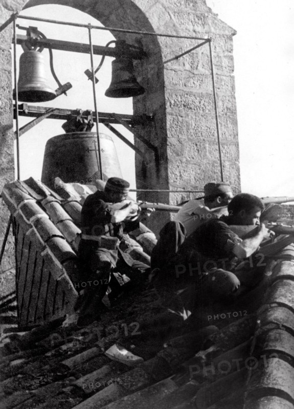 Republican militiamen on the roof of the Sigüenza church, 1936