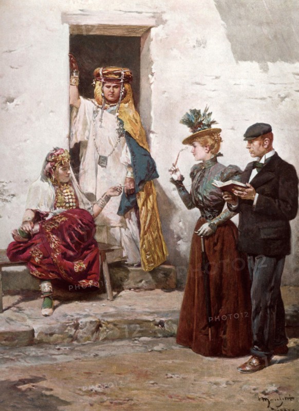 Pendant l'hiver 1900, lors des fêtes commémoratives à BISKRA, un couple de colons français observe une OULED-NAIL. Les OULED NAILS sont des femmes originaires des tribus du sud de l'Algérie. Danseuses dévoilées vêtues d'étoffes chatoyantes, elles portent une grande partie de leur fortune sous forme de pièces d'or montées en collier et exécutent de très vieilles danses traditionnelles.  Pendant l'hiver 1900, lors des fetes commemoratives a BISKRA, un couple de colons francais observe une OULED-NAIL. Les OULED NAILS sont des femmes originaires des tribus du sud de l'Algerie. Danseuses devoilees vetues d'etoffes chatoyantes, elles portent une grande partie de leur fortune sous forme de pieces d'or montees en collier et executent de tres vieilles danses traditionnelles.