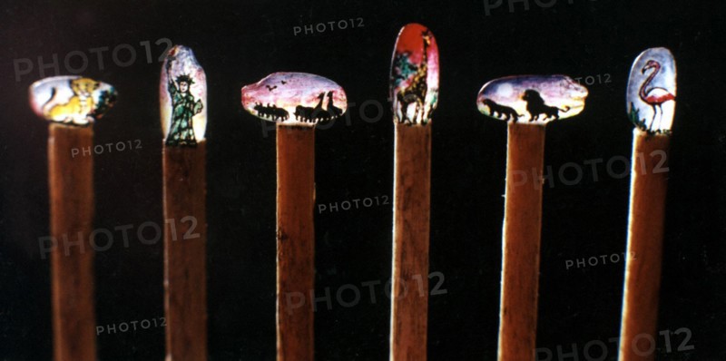 Engraving and painting on a Grain of Rice