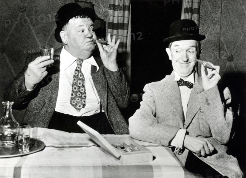 Stan LAUREL and Oliver HARDY with cigars